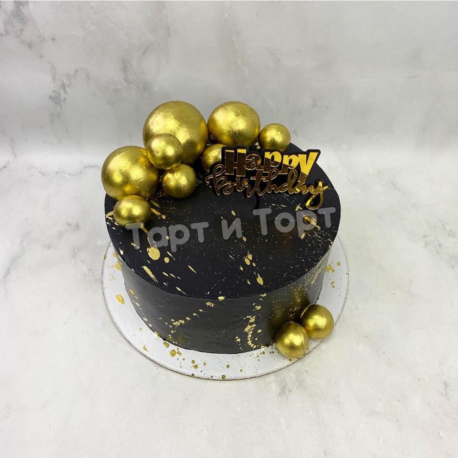 Чёрный торт с золотыми шариками и брызги