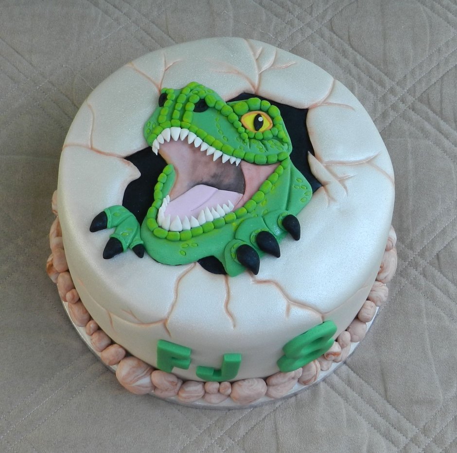 Мордочка динозавра на торте