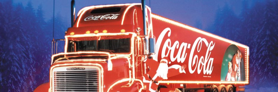 Грузовики Кока кола в колонне на новый год